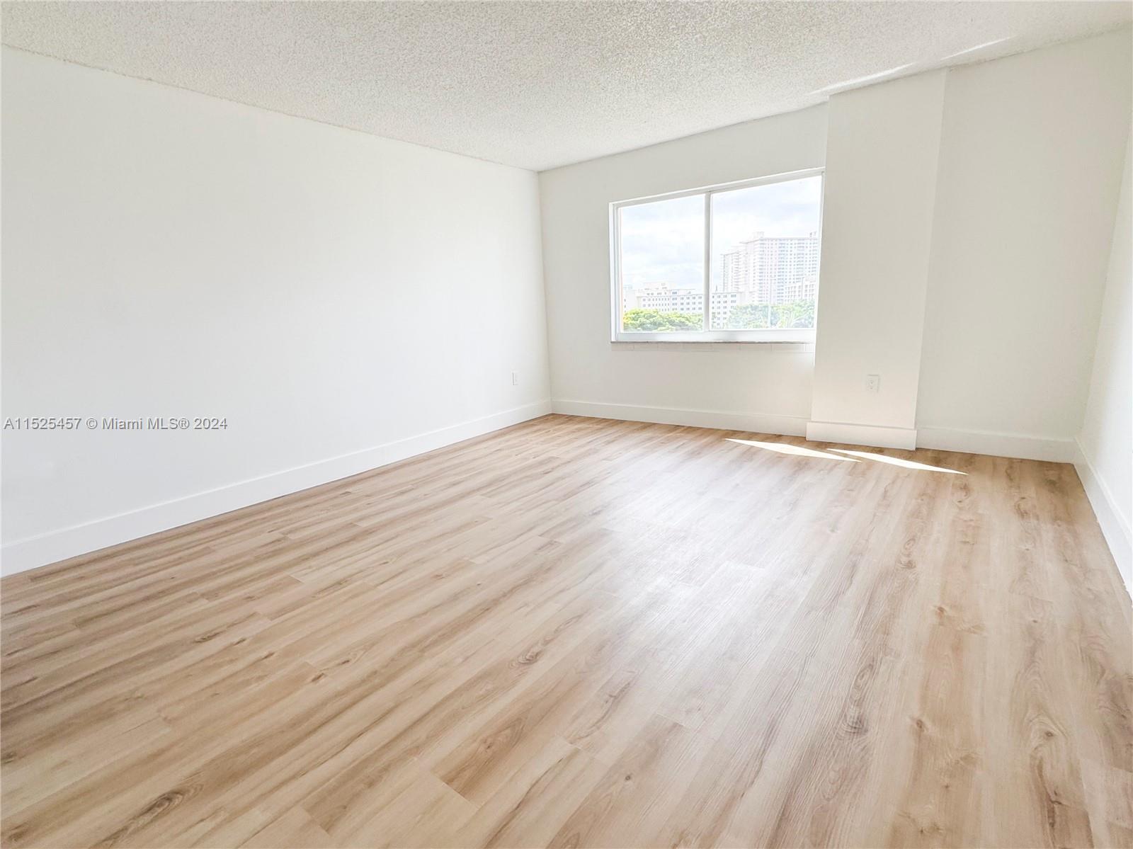 Unstaged vacation rental bedroom in Sunny Isles Beach