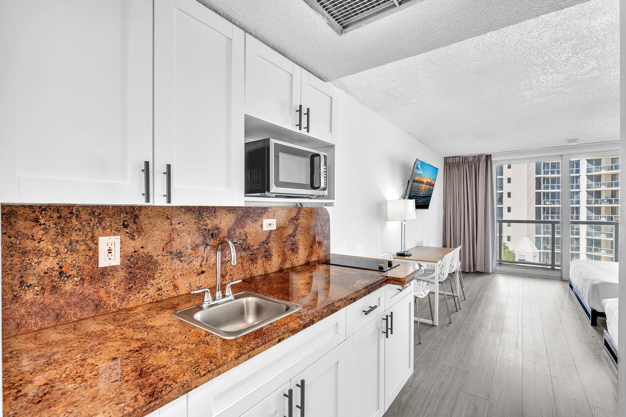 Studio Retreat with Balcony and Partial Ocean View- 424