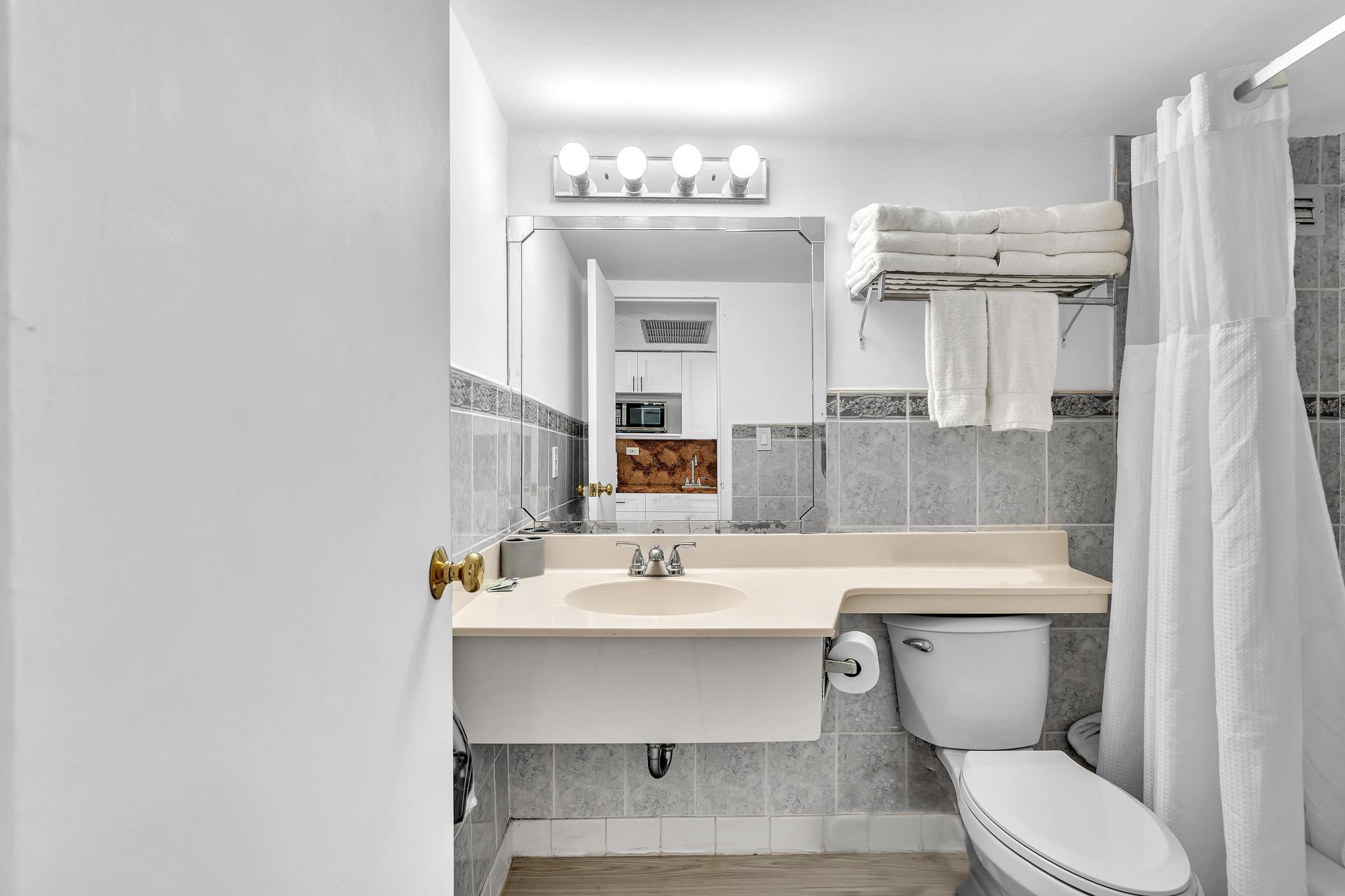 Studio Retreat with Balcony and Partial Ocean View- 424