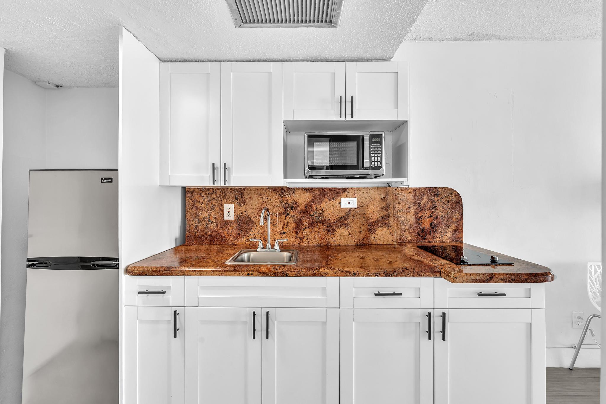 Studio Retreat with Balcony and Partial Ocean View- 424