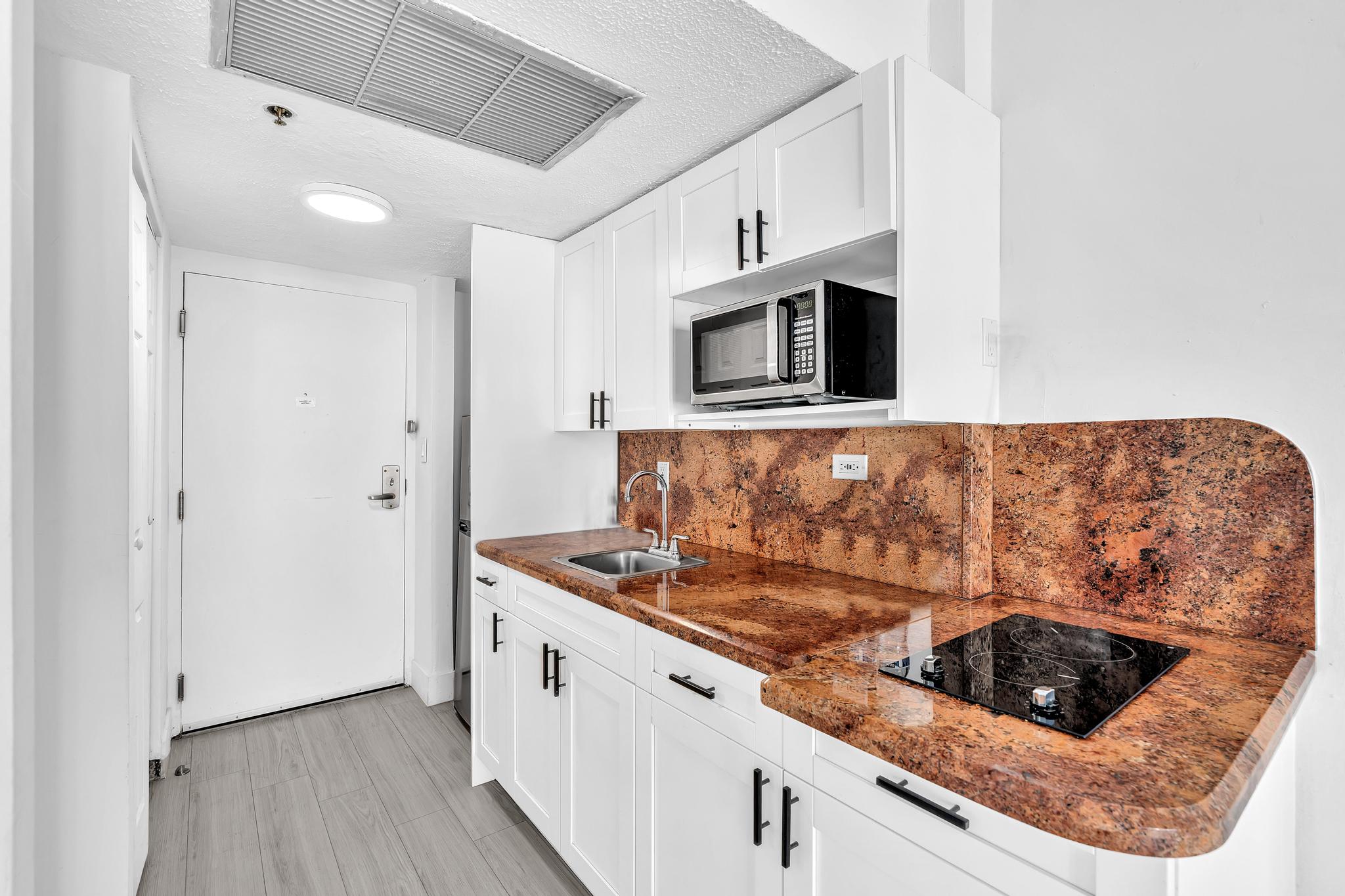 Studio Retreat with Balcony and Partial Ocean View- 424